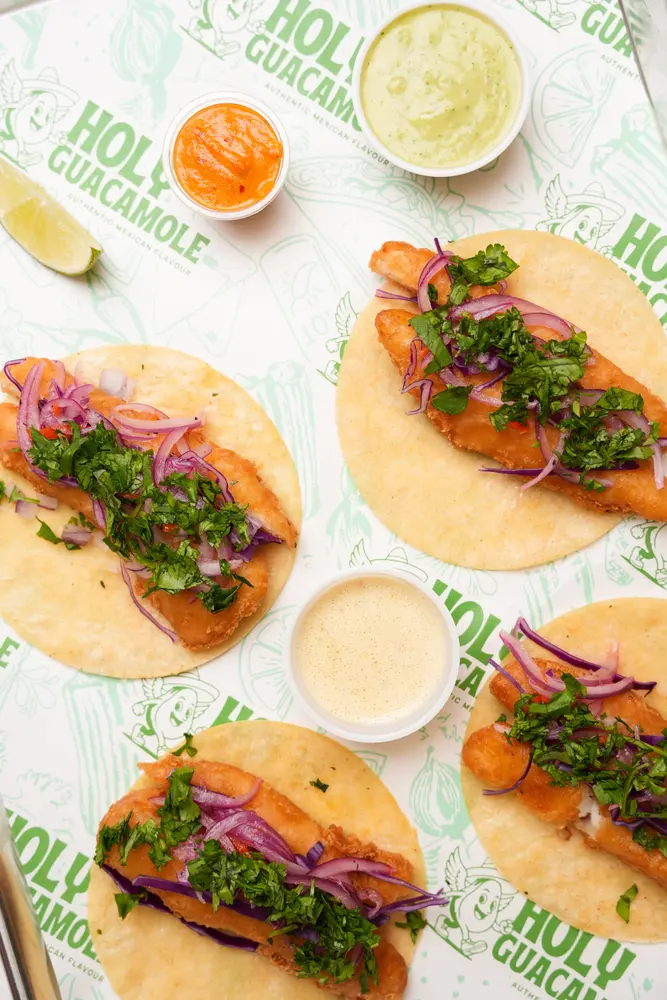 Fish tacos with red onion and cilantro