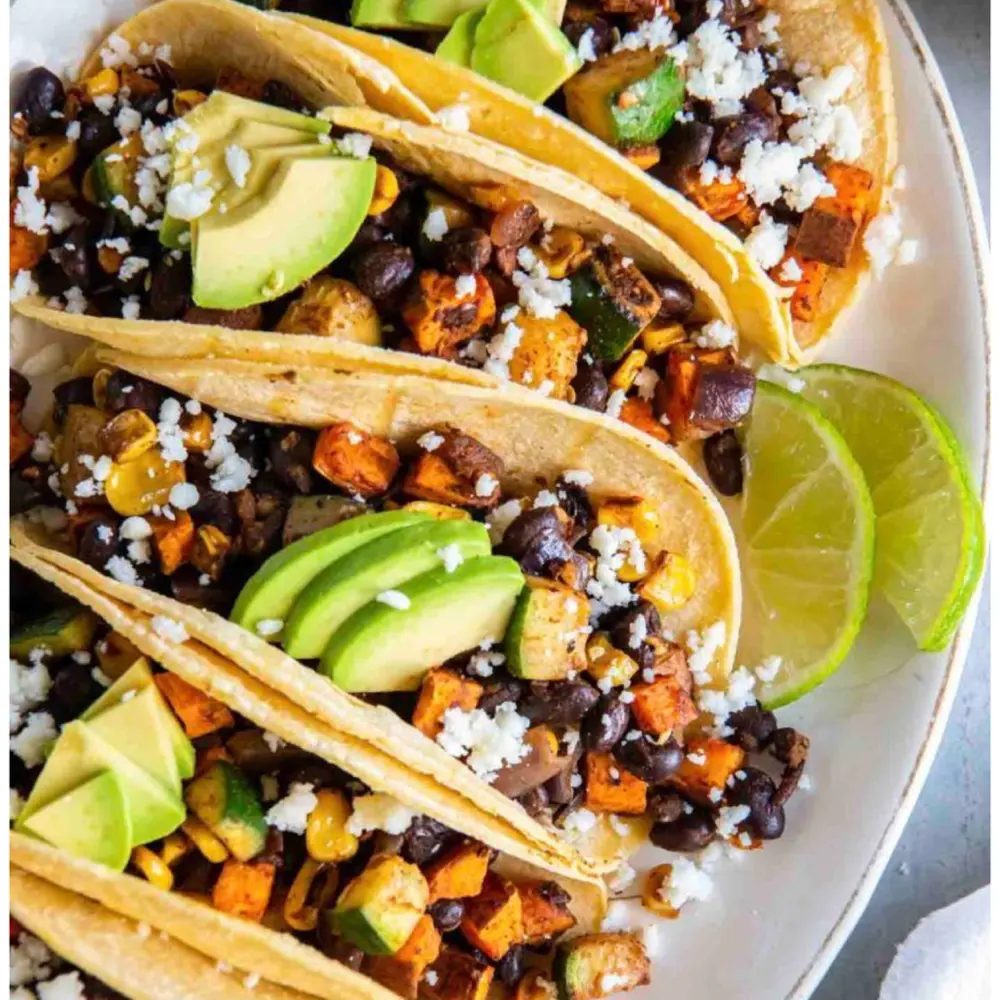 Veggie tacos with avocado, black beans and lime